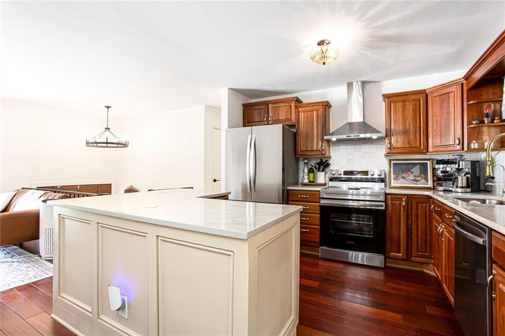 2814 Goodfellows Road Tucker, GA 30084 - Photo 18 of 46 a kitchen with a stove a sink and a refrigerator