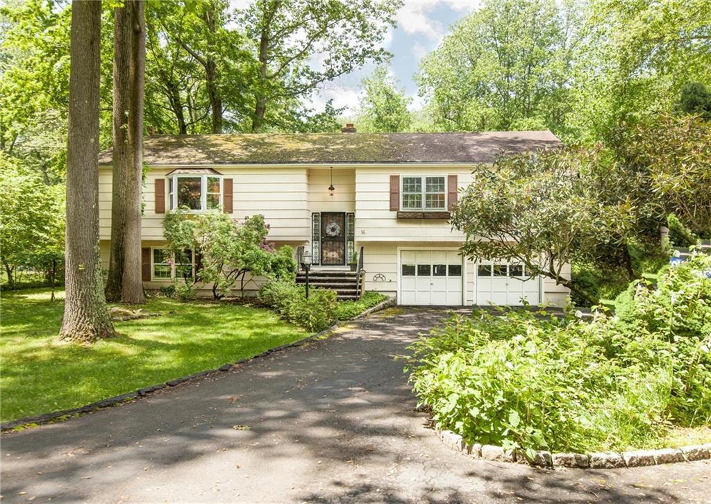 16 Valley Field Road Westport, CT 06880 - Photo 1 of 1 front view of a house with a yard