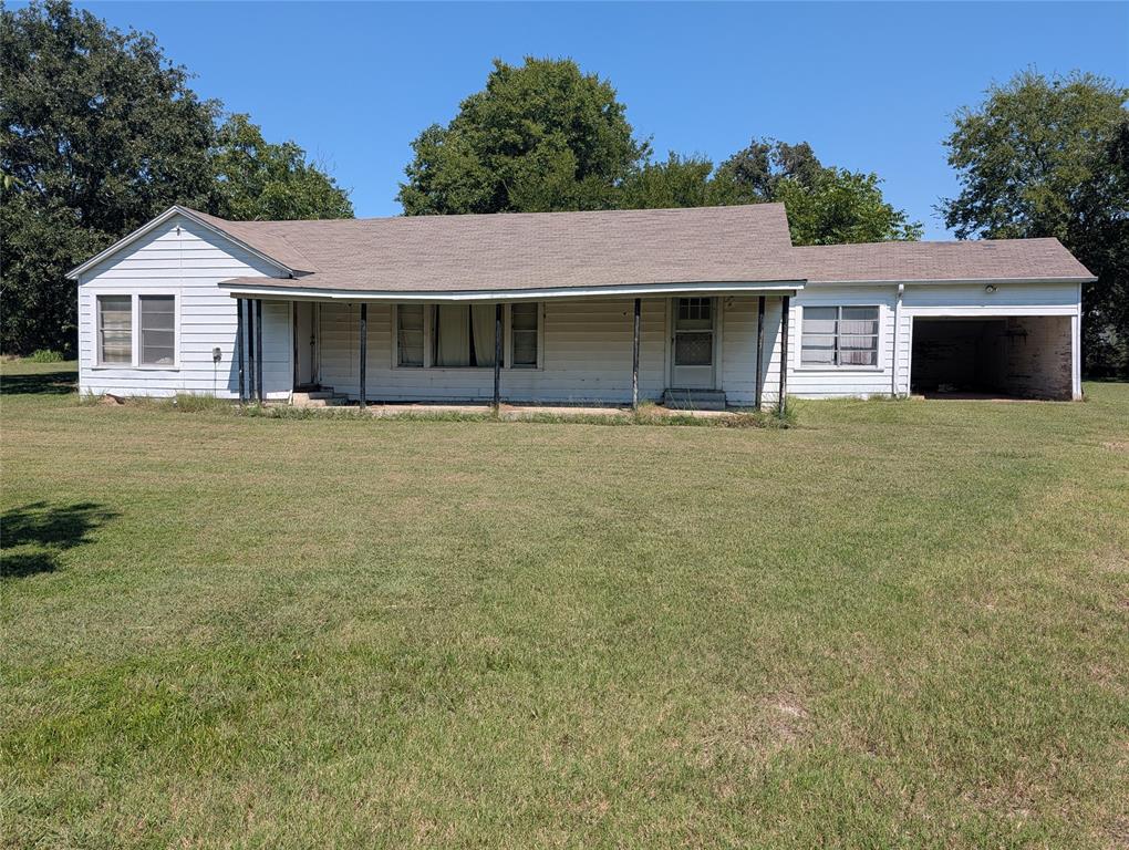 11478 Gordon Lane Mabank, TX 75147 - Photo 25 of 27 a front view of a house with a garden