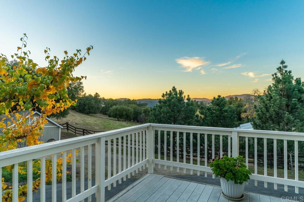 25350 Mesa Grande Road Santa Ysabel, CA 92070 - Photo 2 of 55 a view of a balcony with wooden floor and fence