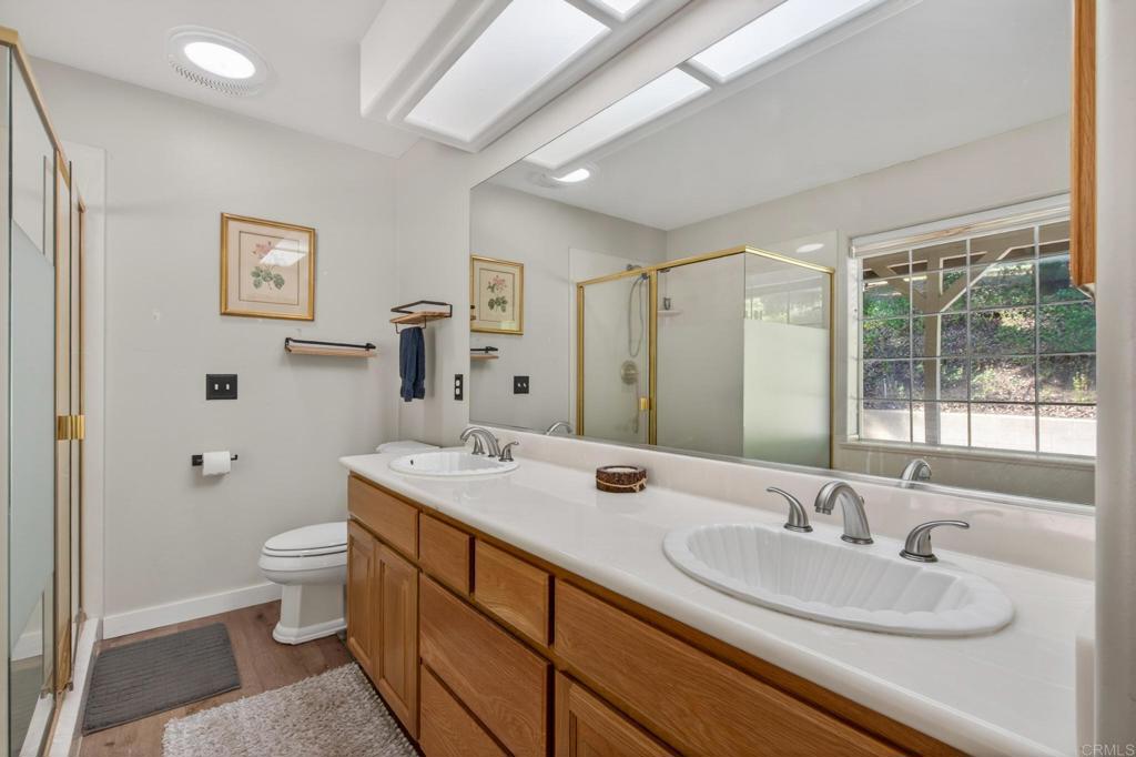 25350 Mesa Grande Road Santa Ysabel, CA 92070 - Photo 24 of 55 a bathroom with a sink double vanity and a toilet
