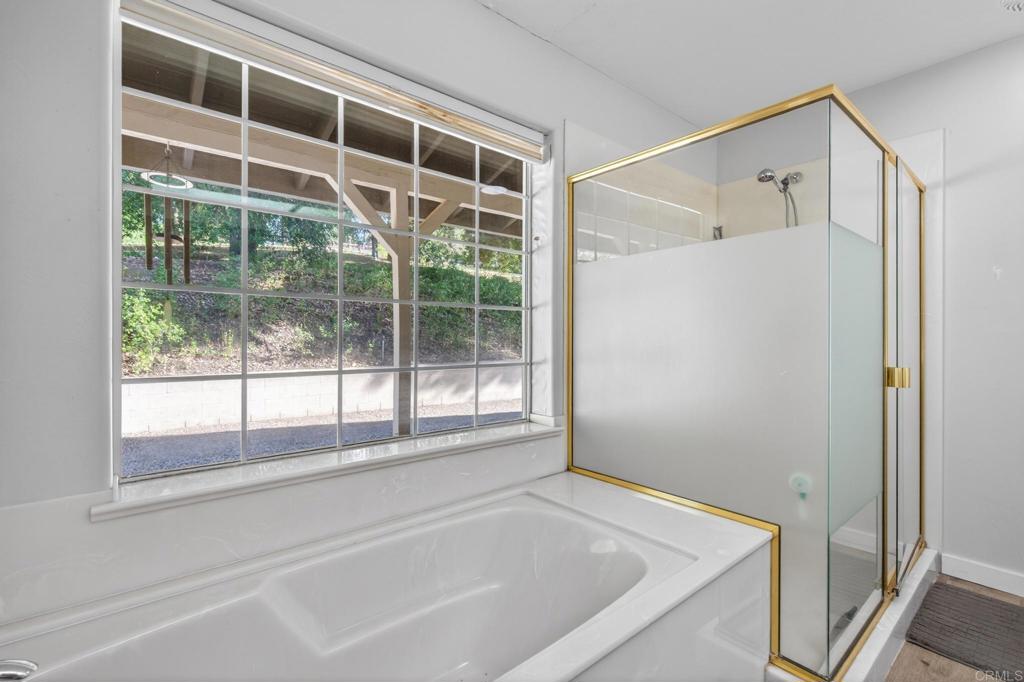 25350 Mesa Grande Road Santa Ysabel, CA 92070 - Photo 25 of 55 a bathroom with a bathtub and a shower