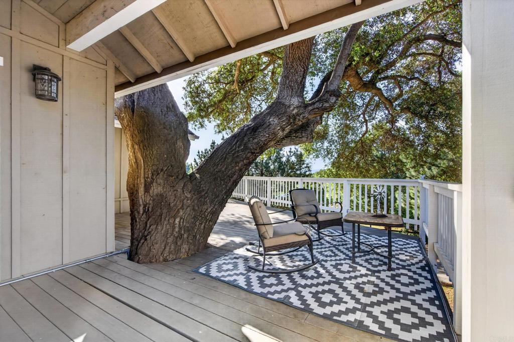 25350 Mesa Grande Road Santa Ysabel, CA 92070 - Photo 28 of 55 a balcony with wooden floor and outdoor seating