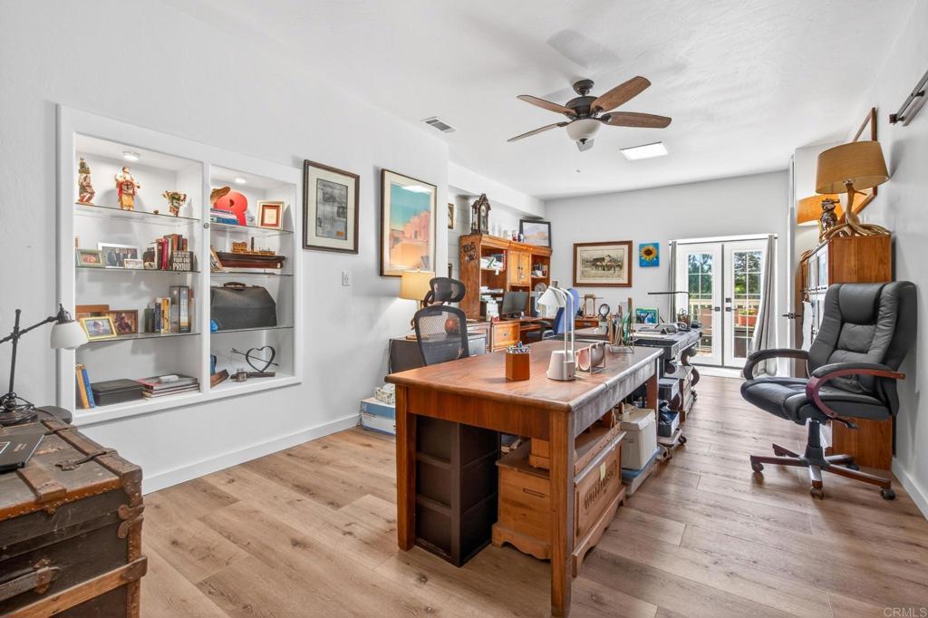 25350 Mesa Grande Road Santa Ysabel, CA 92070 - Photo 31 of 55 a view of a room with workspace and wooden floor