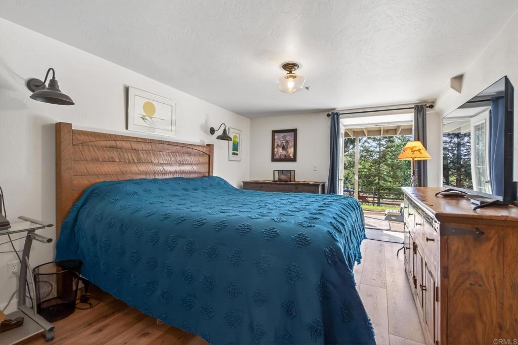 25350 Mesa Grande Road Santa Ysabel, CA 92070 - Photo 33 of 55 a bedroom with a bed and a table
