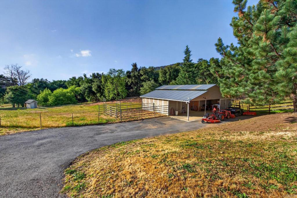 25350 Mesa Grande Road Santa Ysabel, CA 92070 - Photo 4 of 55 a view of a house with swimming pool and a yard