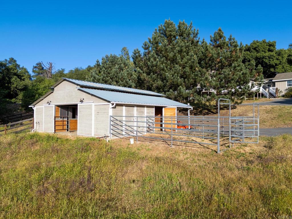 25350 Mesa Grande Road Santa Ysabel, CA 92070 - Photo 45 of 55 a house with trees in the background