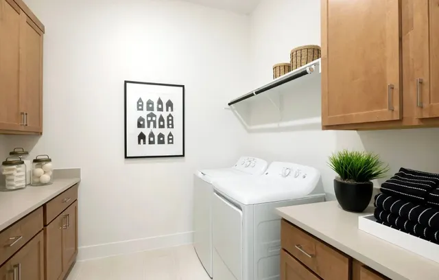 a room with a sink cabinets and wooden floor