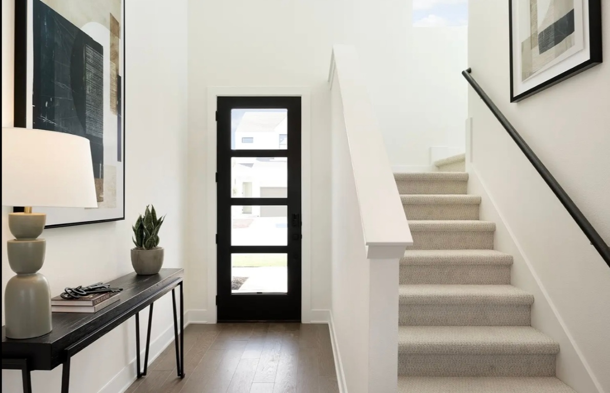 1304 Rambling Rose Road Austin, TX 78745 - Photo 2 of 13 Foyer with stairs and dark wood-type flooring