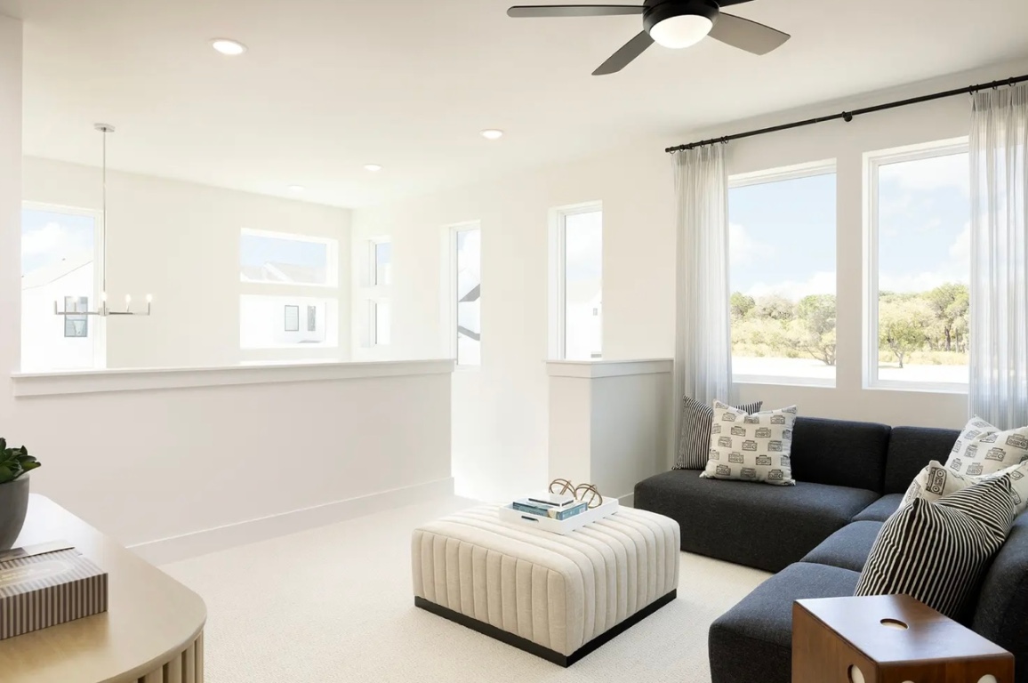 1304 Rambling Rose Road Austin, TX 78745 - Photo 7 of 13 Carpeted living room with a chandelier, recessed lighting, and ceiling fan