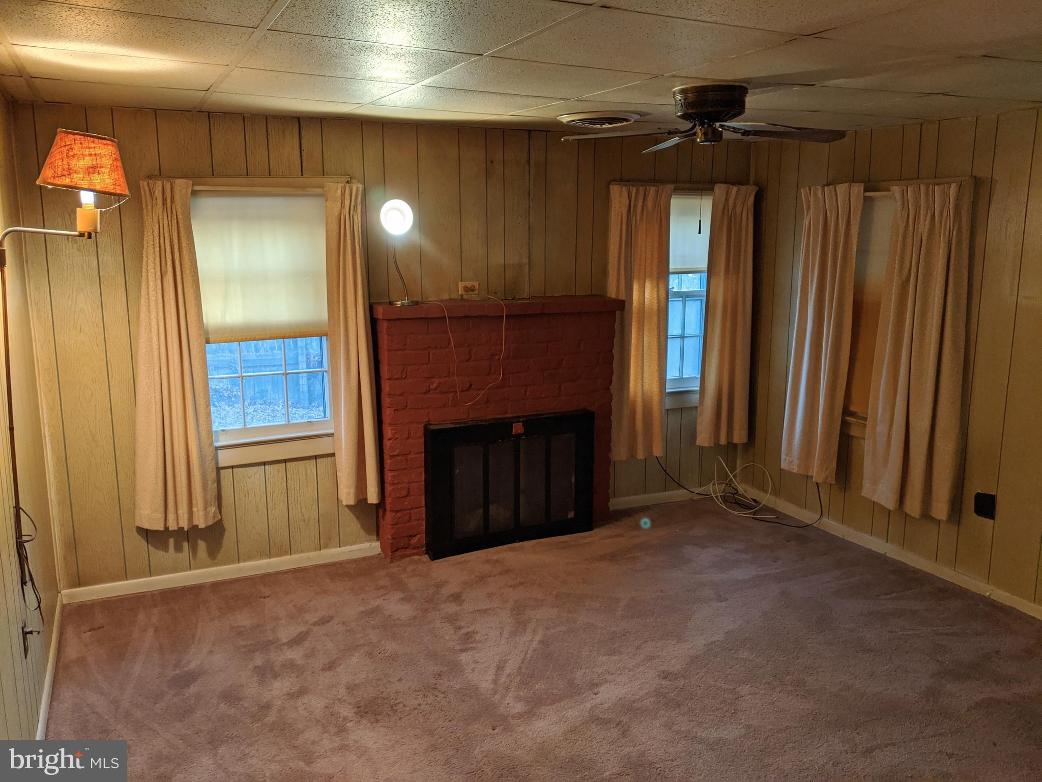 16768 Gridiron Road Cobb Island, MD 20625 - Photo 12 of 28 Living room with brick fireplace