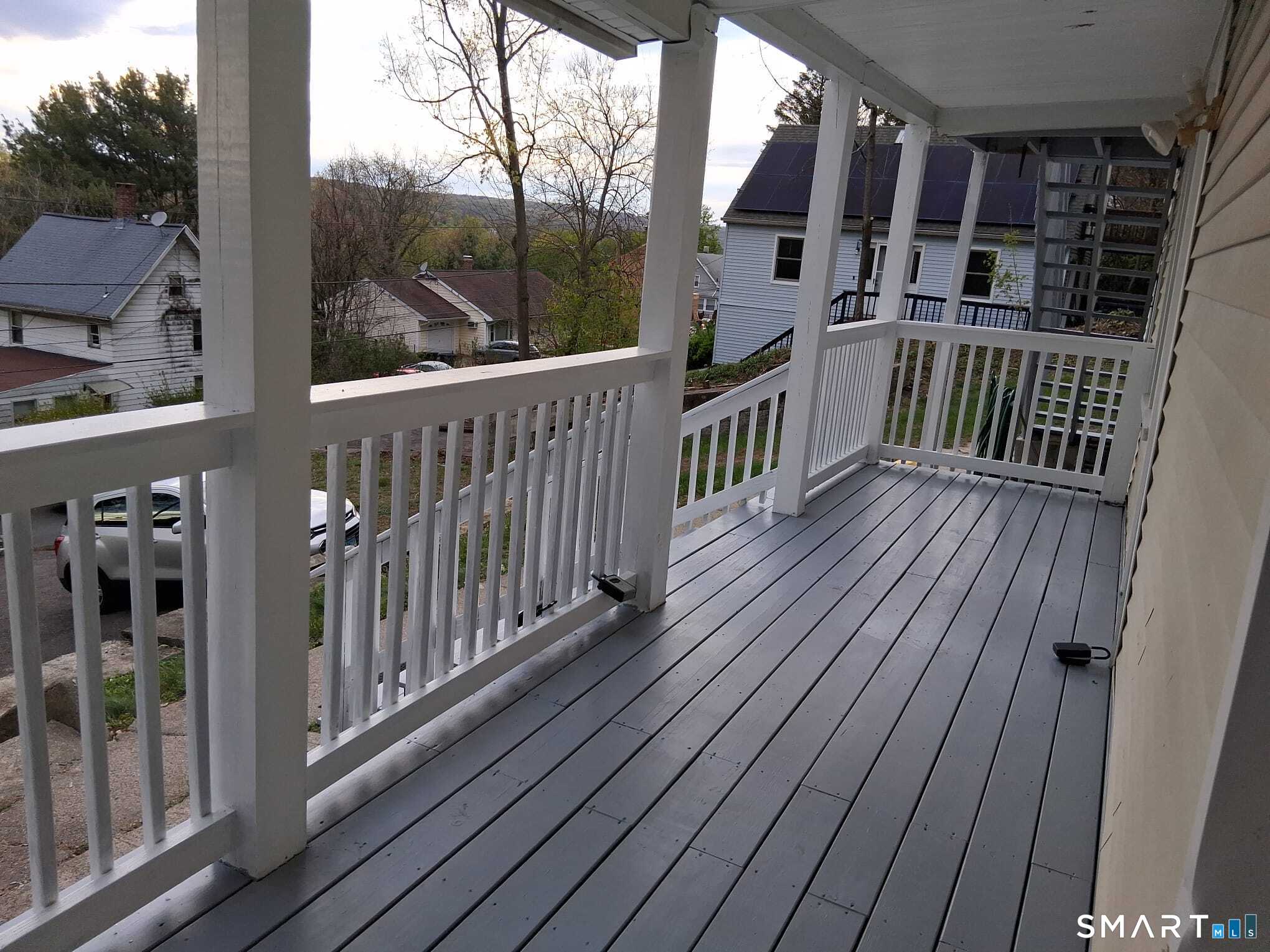 100 Mt Pleasant Street Derby, CT 06418 - Photo 4 of 6 a view of a balcony with wooden floor