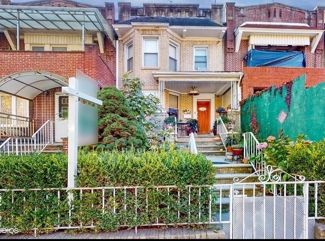 front view of a house with a small yard