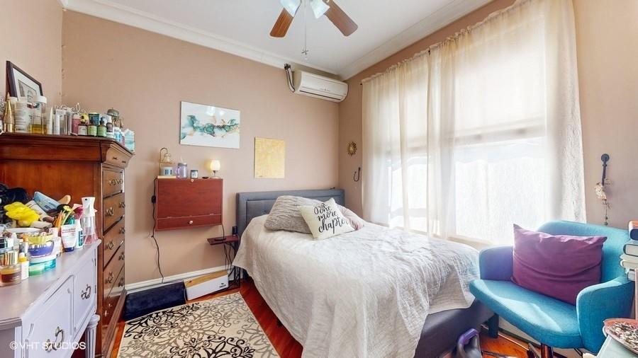 340 86th Street Brooklyn, NY 11209 - Photo 12 of 20 a bedroom with a bed couch and windows
