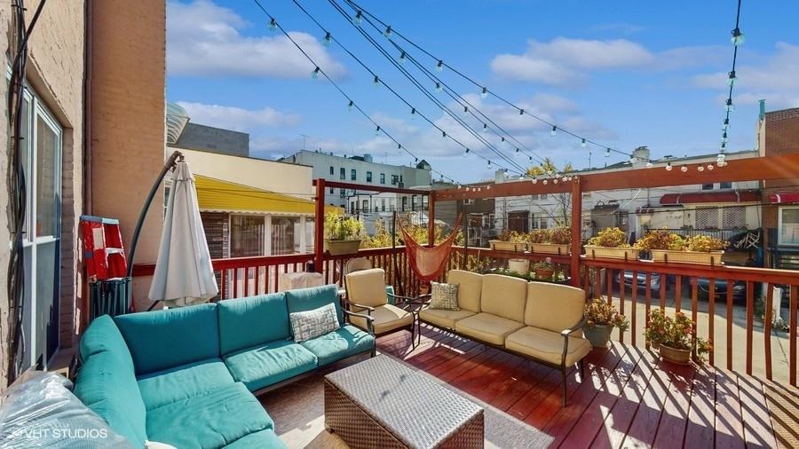 340 86th Street Brooklyn, NY 11209 - Photo 19 of 20 a roof deck with couch and a potted plant