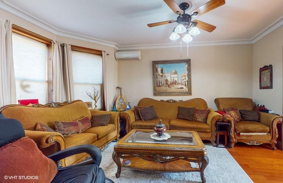 340 86th Street Brooklyn, NY 11209 - Photo 3 of 20 a living room with furniture