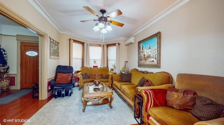 340 86th Street Brooklyn, NY 11209 - Photo 4 of 20 a living room with furniture and a large window