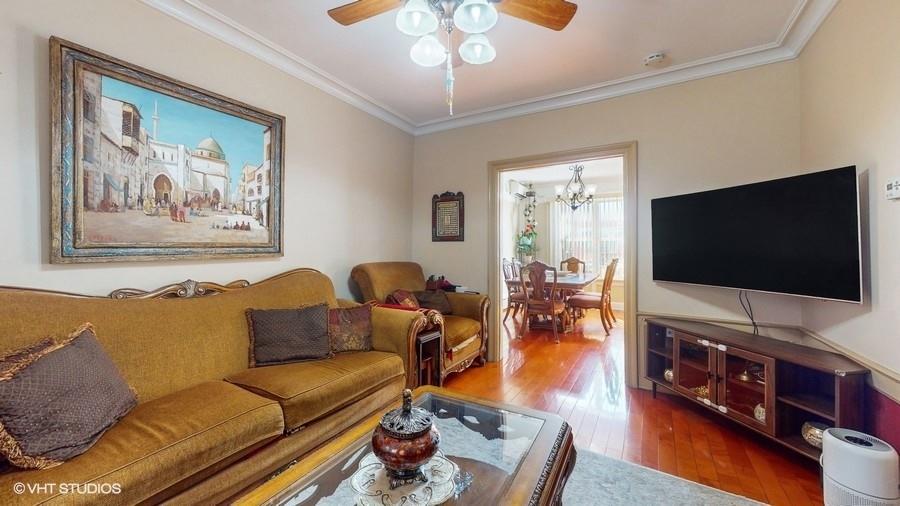 340 86th Street Brooklyn, NY 11209 - Photo 5 of 20 a living room with furniture and a flat screen tv