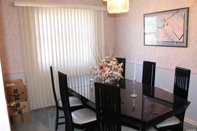 a view of a dining room with furniture and window