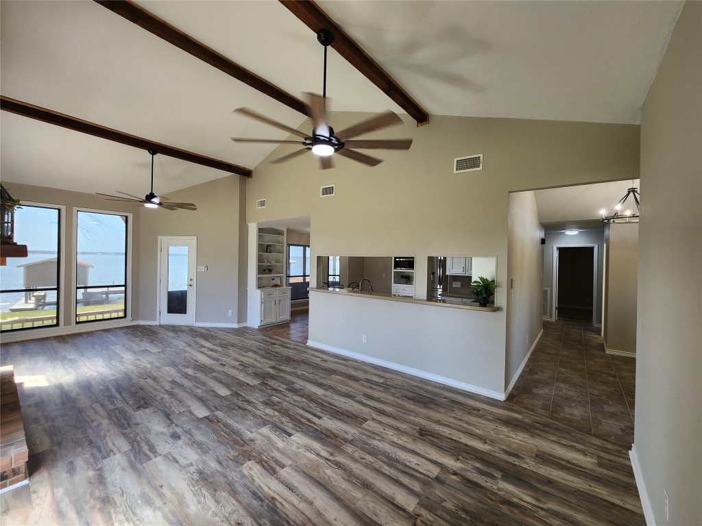 482 West Cattle Drive Onalaska, TX 77360 - Photo 12 of 34 a view of a house with a hallway and wooden floor