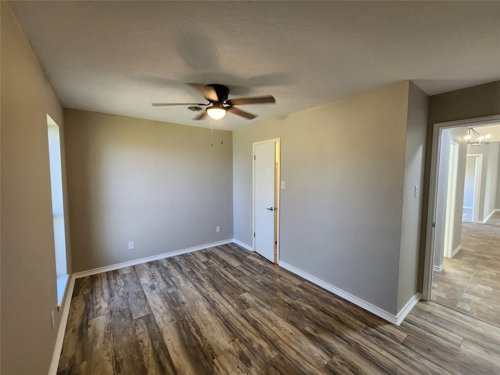 482 West Cattle Drive Onalaska, TX 77360 - Photo 23 of 34 a view of an empty room with wooden floor
