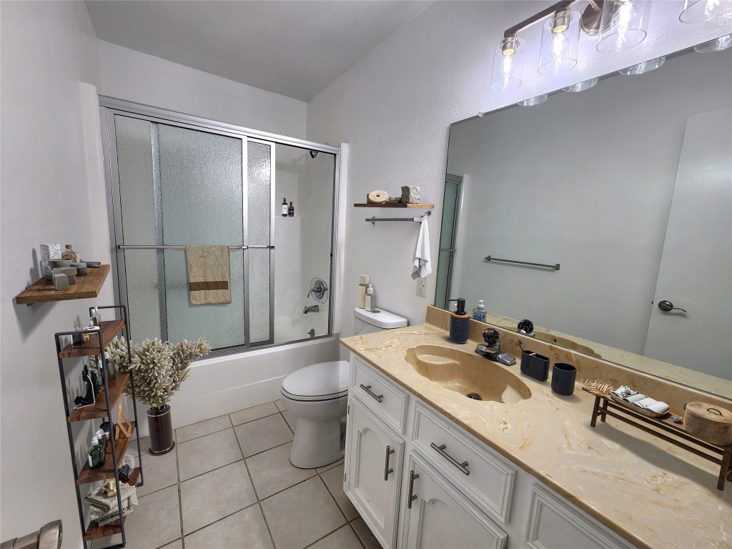 482 West Cattle Drive Onalaska, TX 77360 - Photo 24 of 34 a spacious bathroom with a double vanity sink a toilet and a mirror