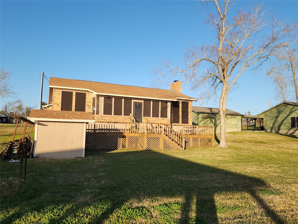 482 West Cattle Drive Onalaska, TX 77360 - Photo 31 of 34 a front view of a house with garden