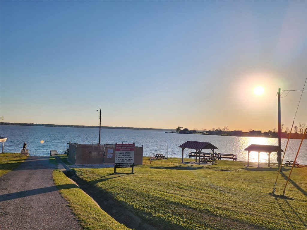 482 West Cattle Drive Onalaska, TX 77360 - Photo 32 of 34 a view of a swimming pool with an ocean view