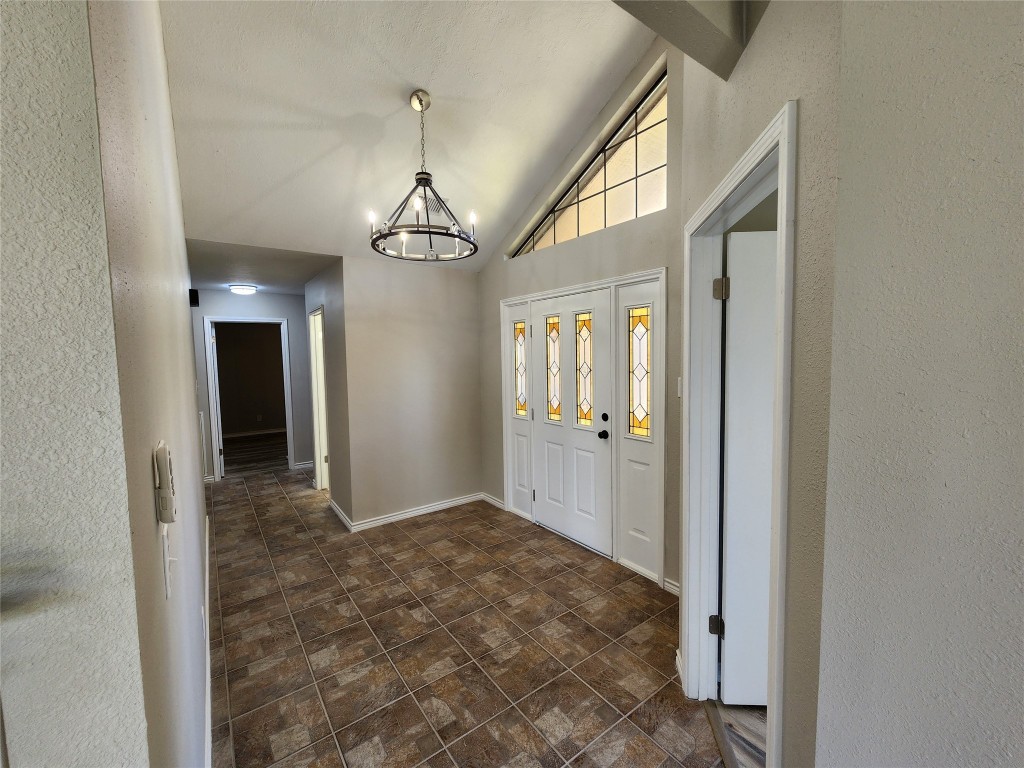 482 West Cattle Drive Onalaska, TX 77360 - Photo 8 of 34 a view of a hallway with wooden floor and chandelier