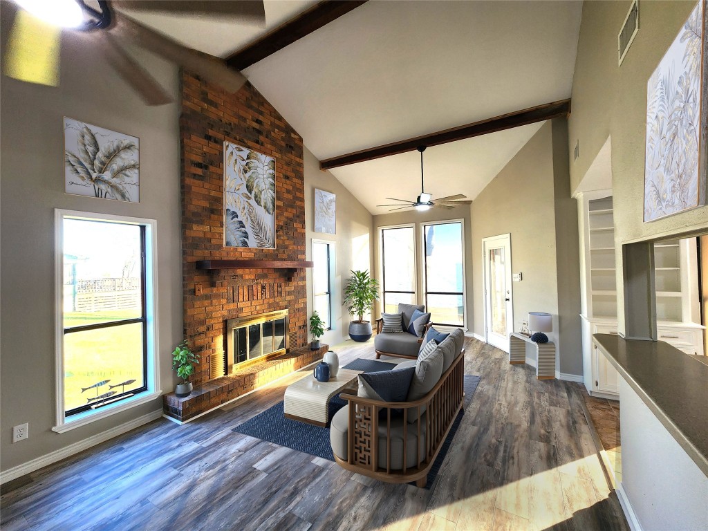 482 West Cattle Drive Onalaska, TX 77360 - Photo 9 of 34 a living room with furniture and a fireplace