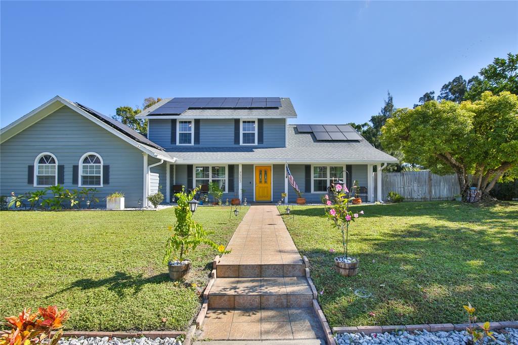a front view of a house with garden