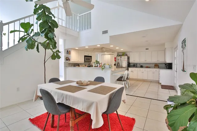 a kitchen with a table and chairs in it