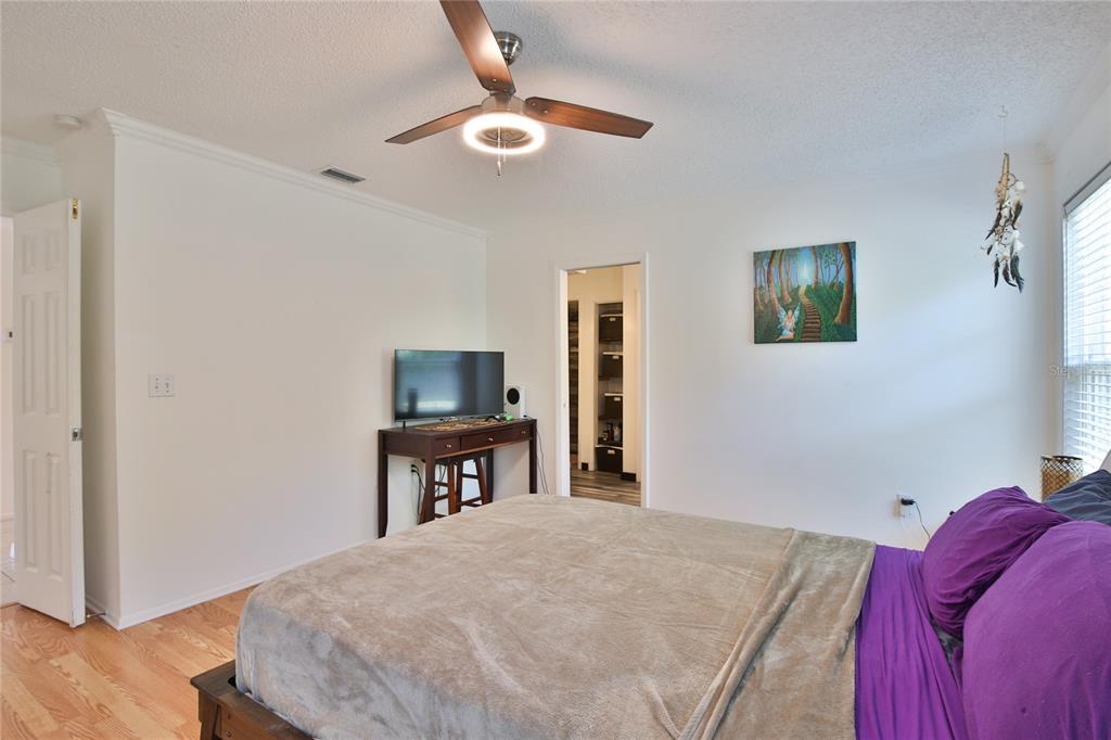 7303 Manatee Street Sarasota, FL 34243 - Photo 19 of 39 a bedroom with a bed and a dresser