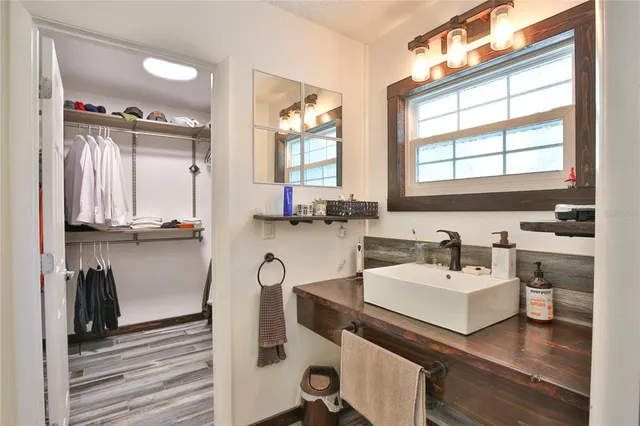 a bathroom with a sink double vanity and a mirror