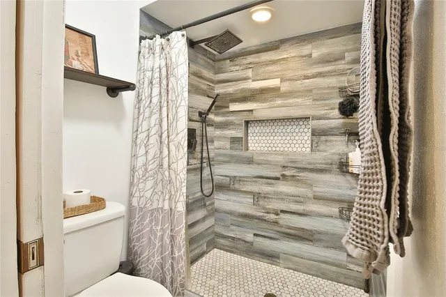 a bathroom with a bathtub and shower
