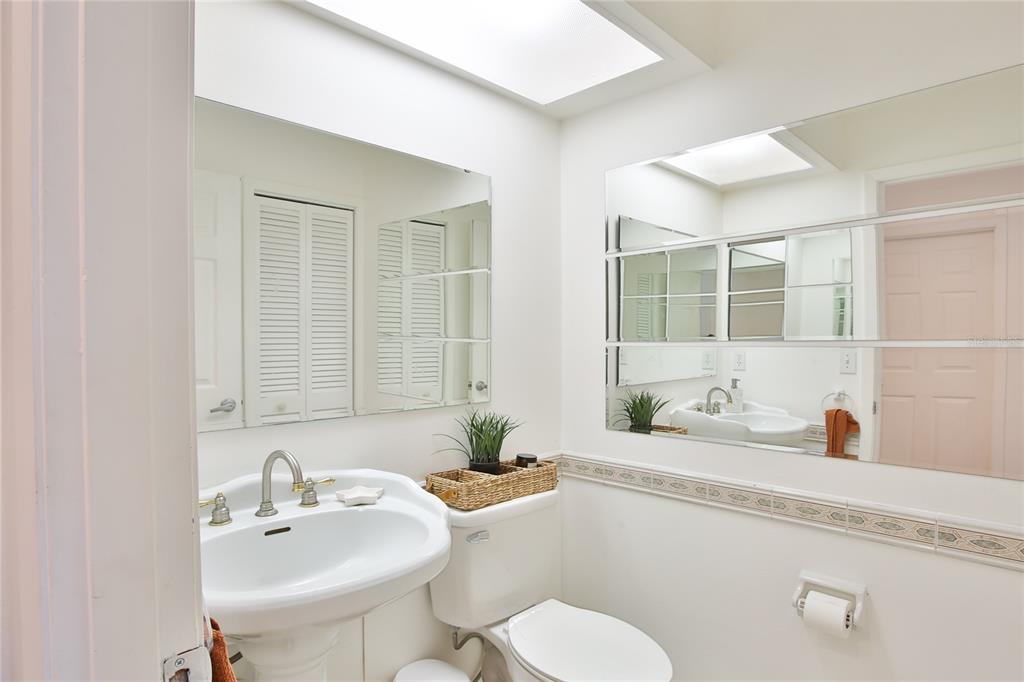 7303 Manatee Street Sarasota, FL 34243 - Photo 24 of 39 a bathroom with a sink and a mirror