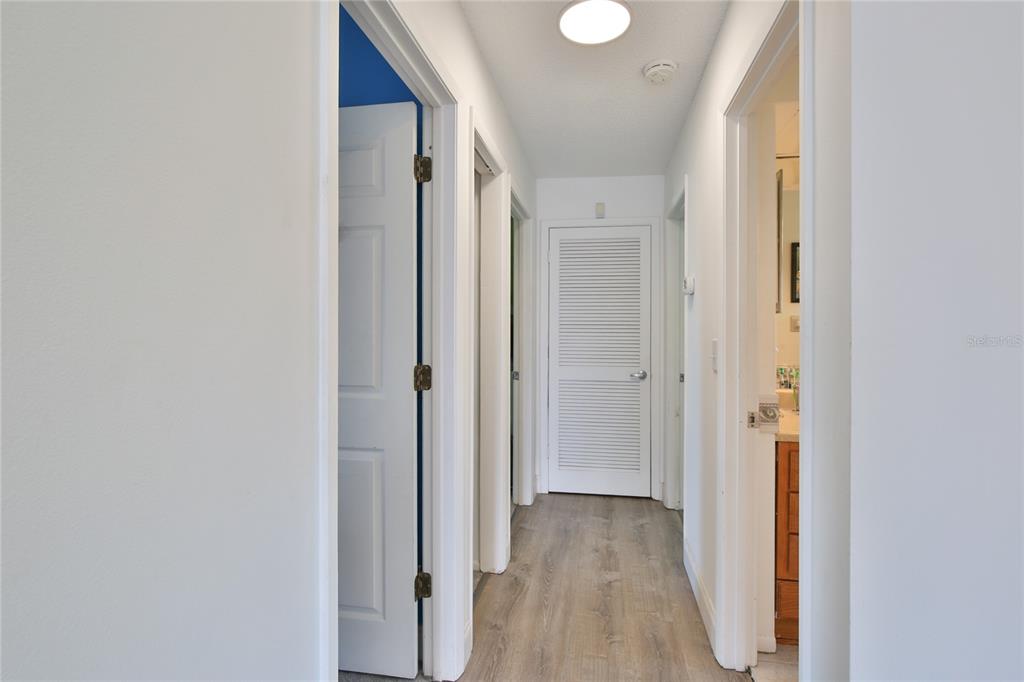 7303 Manatee Street Sarasota, FL 34243 - Photo 28 of 39 a view of a hallway with wooden floor