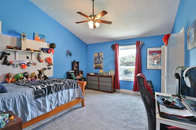 a bedroom with furniture and a bed