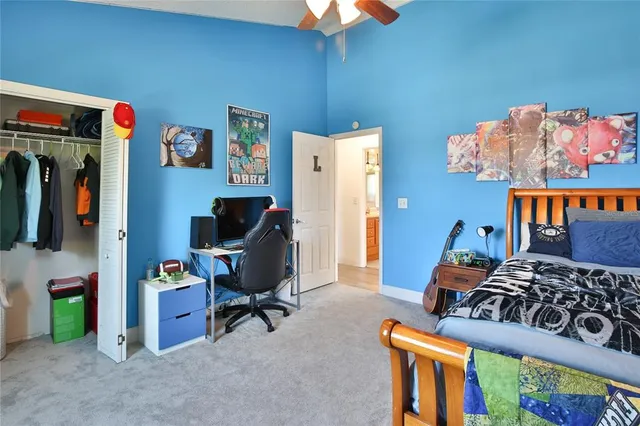 a bedroom with furniture and a window