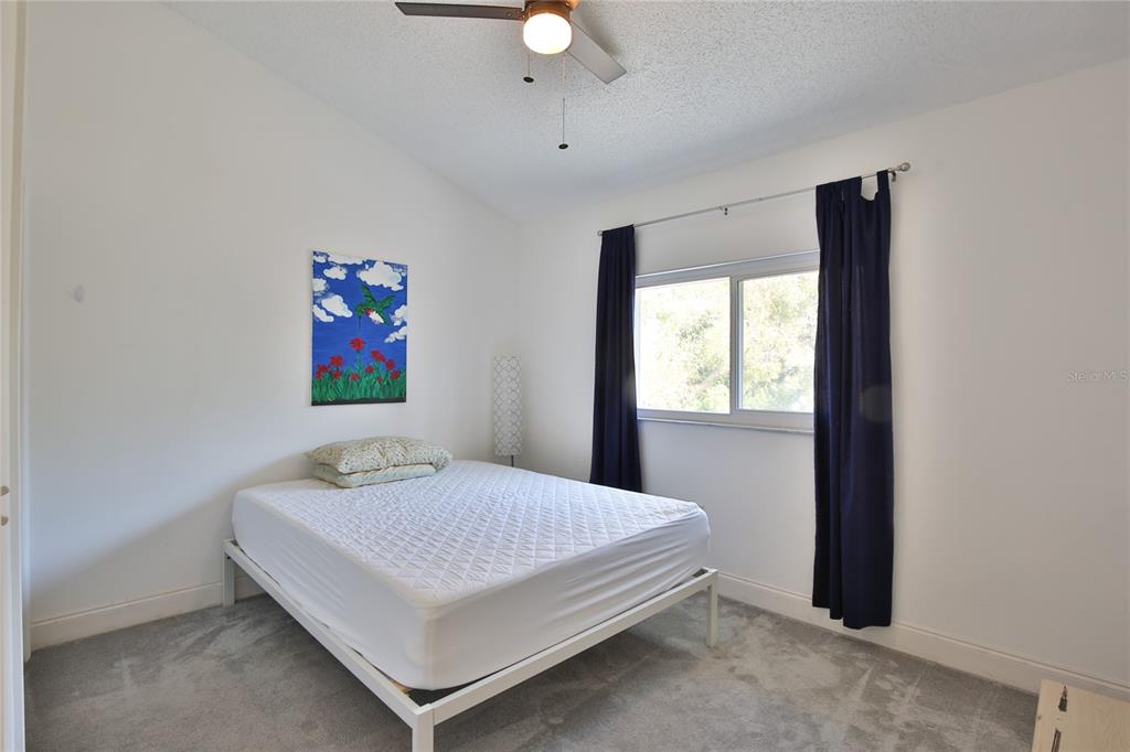 7303 Manatee Street Sarasota, FL 34243 - Photo 33 of 39 a bedroom with a bed and a window