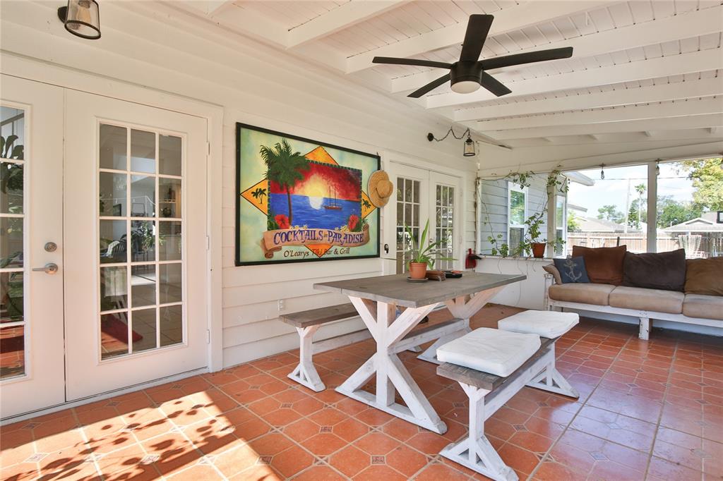 7303 Manatee Street Sarasota, FL 34243 - Photo 35 of 39 a living room with furniture a rug and a flat screen tv