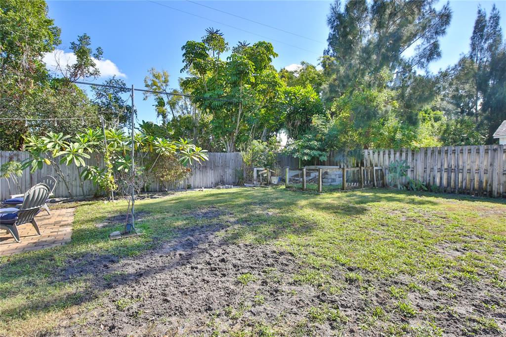 7303 Manatee Street Sarasota, FL 34243 - Photo 36 of 39 a view of a yard with a slide