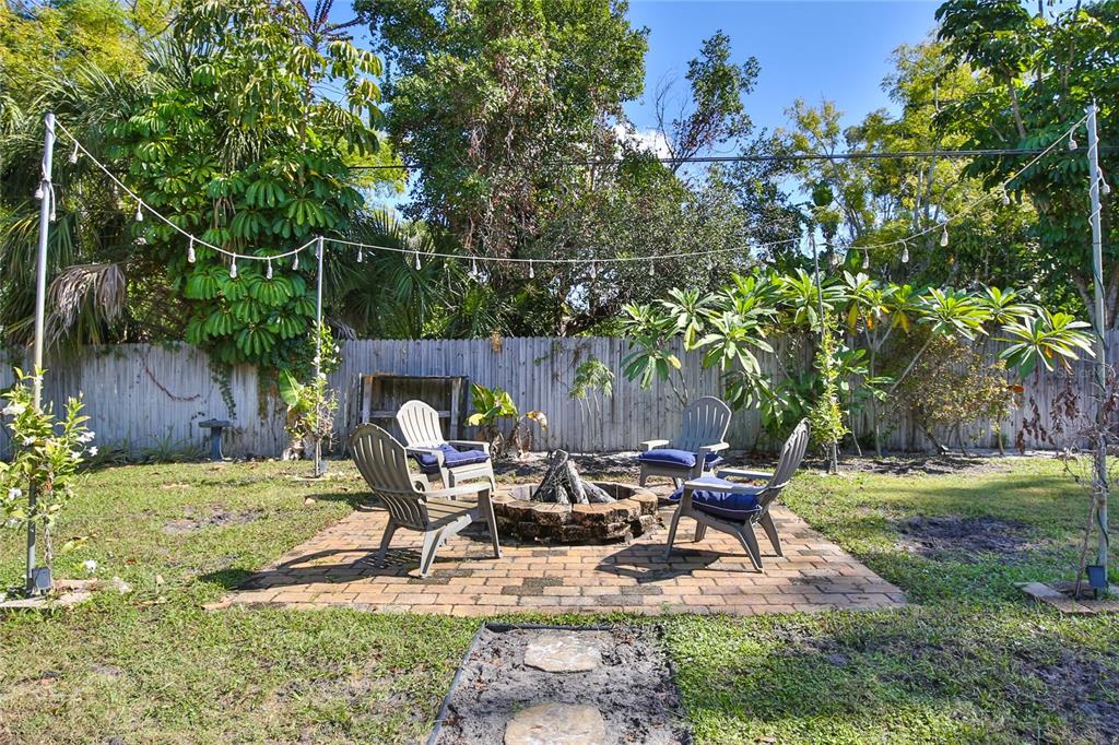 7303 Manatee Street Sarasota, FL 34243 - Photo 38 of 39 a swimming pool with outdoor seating and yard