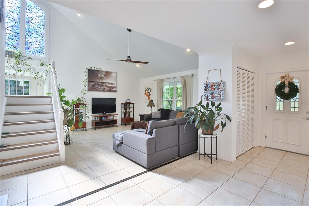 7303 Manatee Street Sarasota, FL 34243 - Photo 6 of 39 a living room with furniture and a fireplace