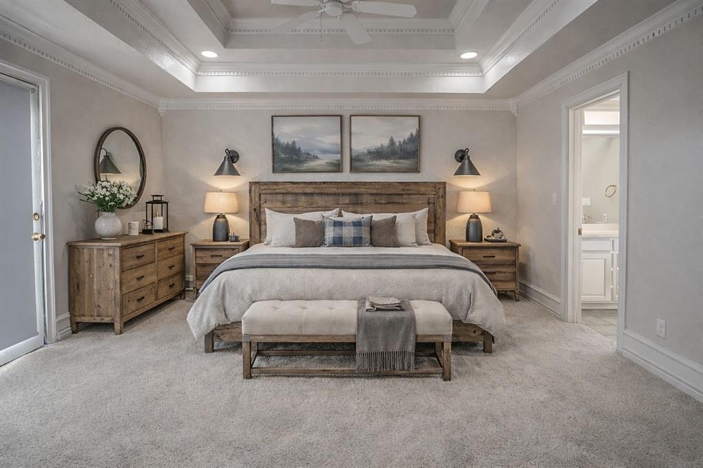 1041 Clarence Road Temple, TX 76501 - Photo 23 of 36 a bedroom with a bed and a chandelier