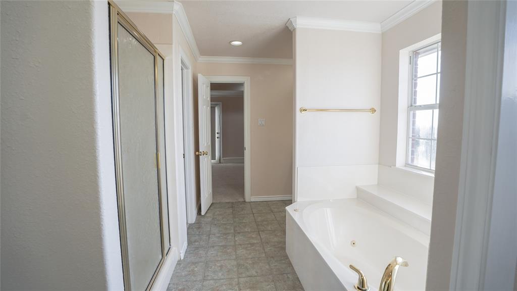 1041 Clarence Road Temple, TX 76501 - Photo 25 of 36 a bathroom with a bathtub and a shower