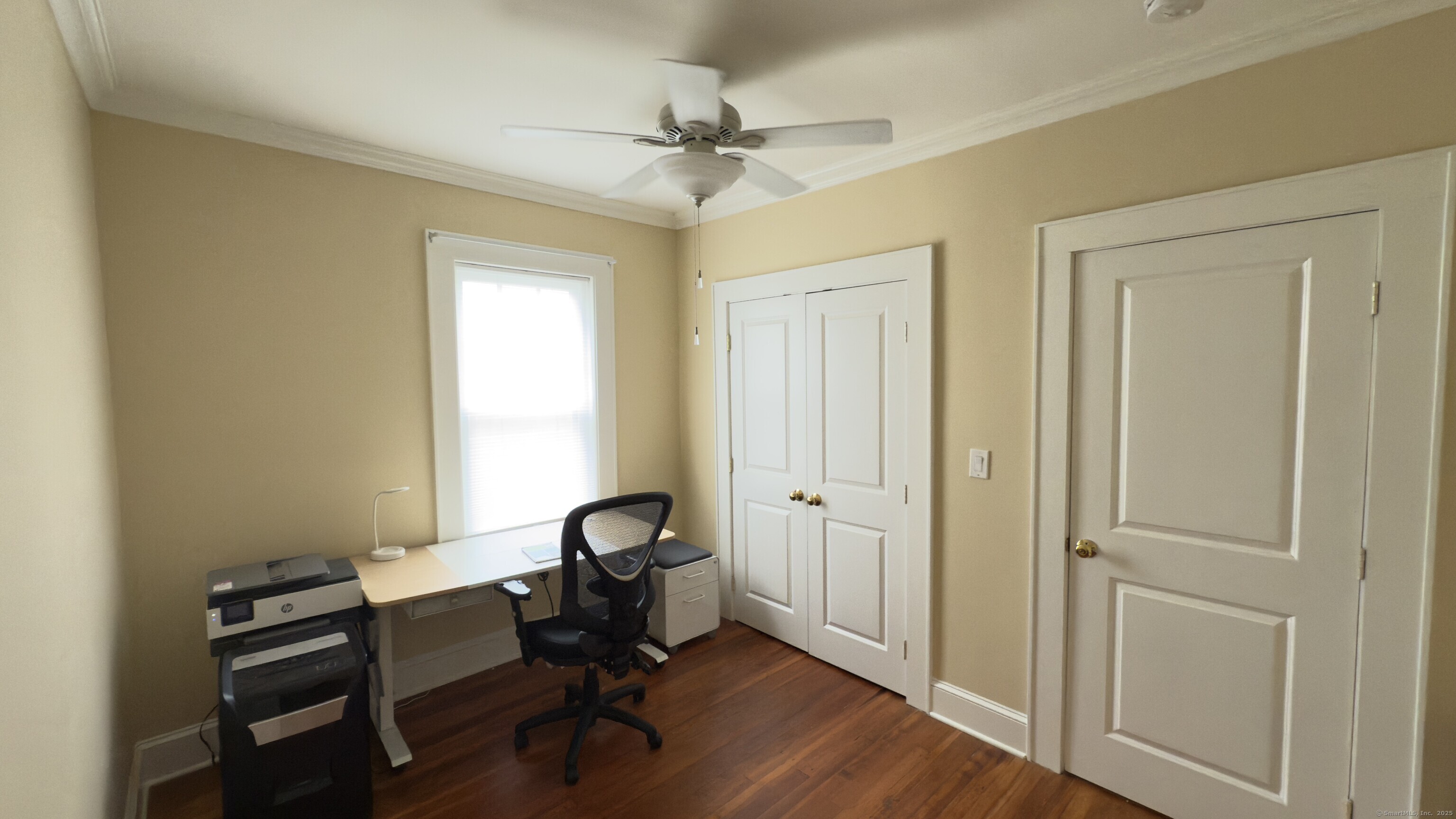 450 Davidson Street Bridgeport, CT 06605 - Photo 14 of 16 a view of a workspace with furniture and a window
