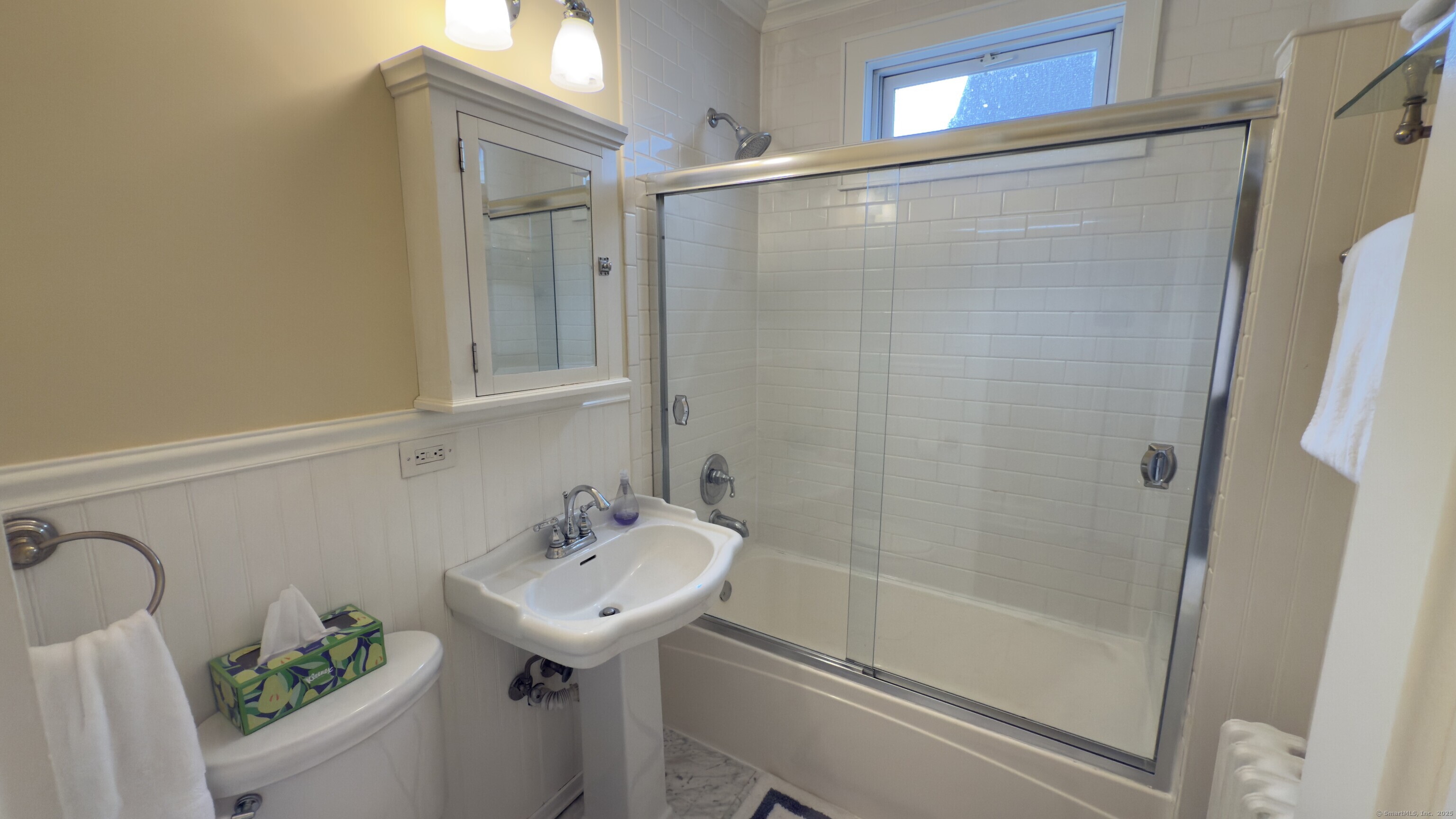 450 Davidson Street Bridgeport, CT 06605 - Photo 15 of 16 a bathroom with a sink and mirror