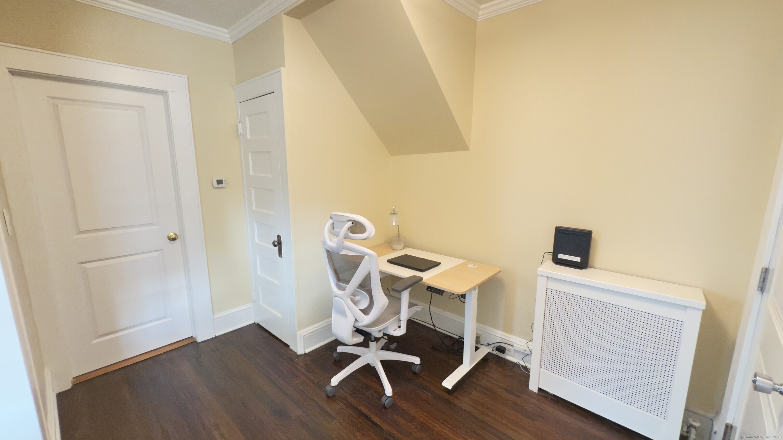 450 Davidson Street Bridgeport, CT 06605 - Photo 4 of 16 a view of a workspace with furniture and wooden floor