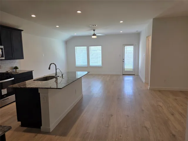 a kitchen with sink and window